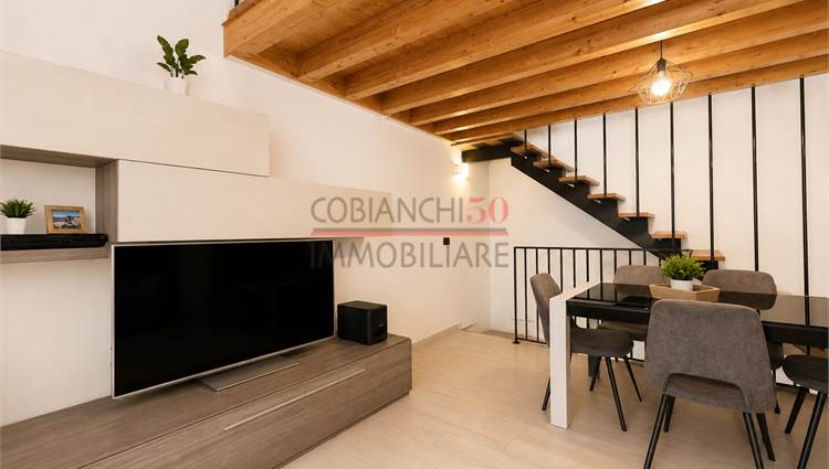 Soggiorno con cottura piano 1